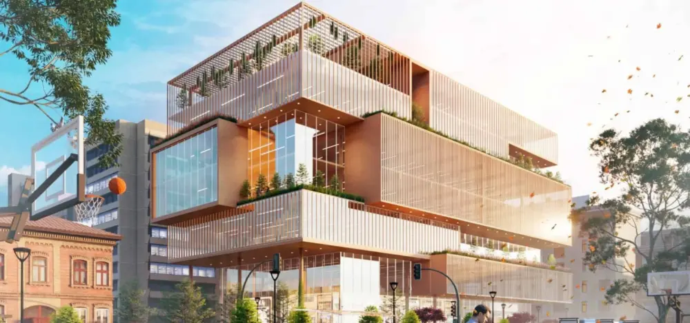 Modern multi-level building with glass and greenery